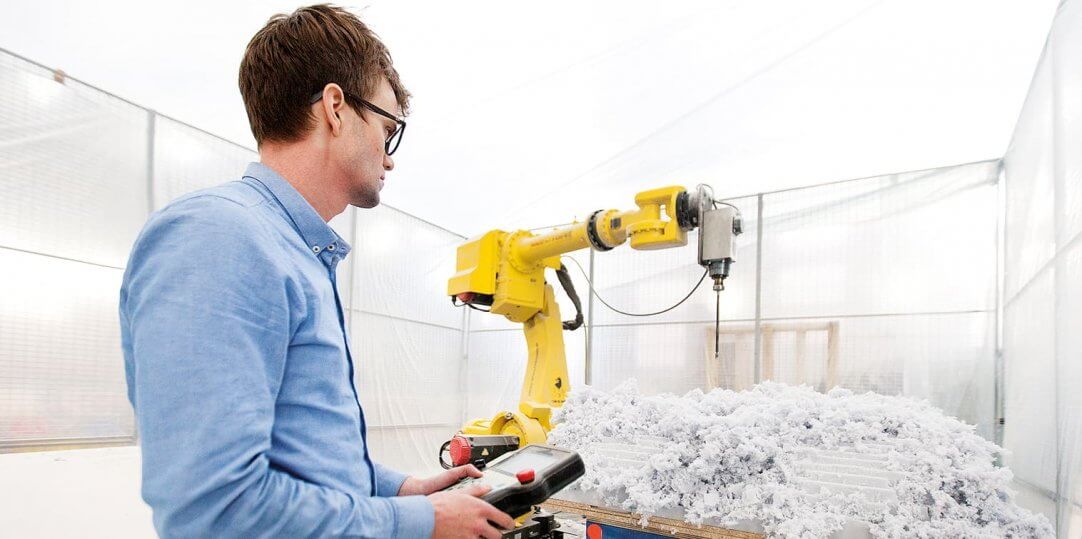Man controlling a robot